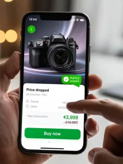 Price tracking app on a smartphone notifying about a deal on an electronic device.