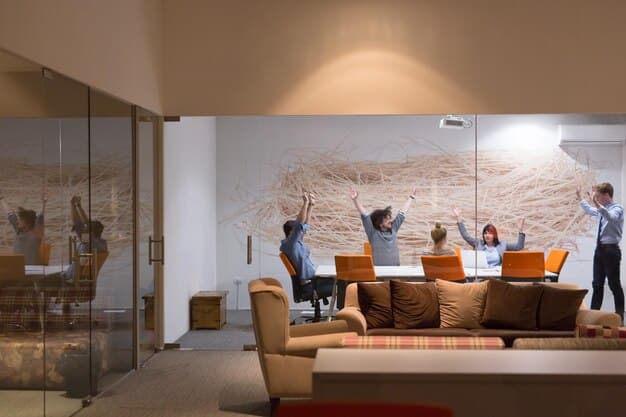 An office interior with a focus on collaboration and modern design, showcasing flexible workspaces, lounge areas, and employees engaged in a meeting, reflecting the changing needs of businesses in the current market.