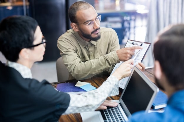 A group of employees participating in a data privacy training session. The facilitator is pointing to a slide with key data protection principles. The employees are engaged and taking notes.