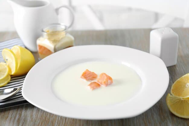 A plate with salmon, eggs, and a glass of fortified milk.