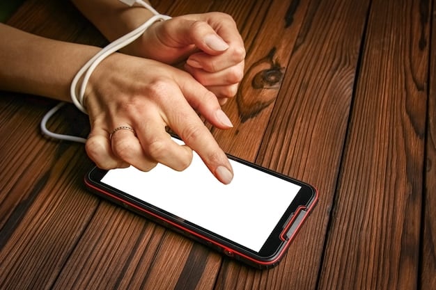 Close-up photo of a hand holding a phone, dialing a crisis hotline number. The background is blurred, emphasizing the act of reaching out for help during a difficult time.