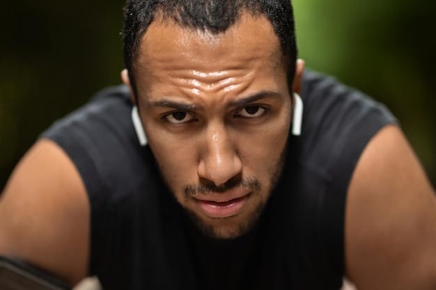 A close-up of a person's face while running, showing a determined expression and sweat, symbolizing the physical exertion and mental focus required for regular exercise and the resulting sense of accomplishment.