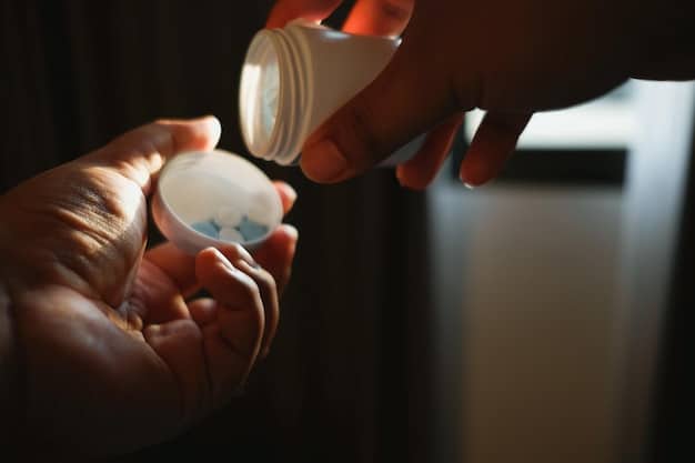 A close up of prescription opioid pills being poured from a labeled container, symbolizing the role of over-prescription in the opioid crisis.