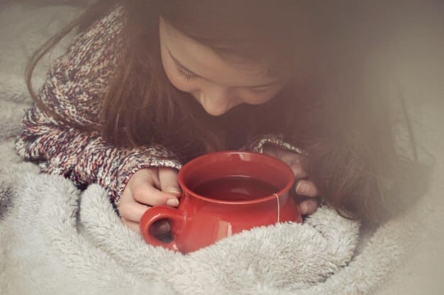 A person enjoying a cup of herbal tea in a cozy setting, with soft lighting and calming colors. The image should evoke a sense of relaxation and self-care.