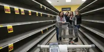 Empty grocery shelves and rising food prices, illustrating inflation's impact on consumers.